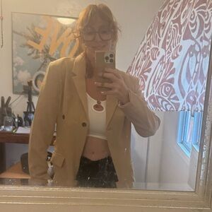 Adorable new without tags blazer. Super cute on. Def for cooler weather. Size L